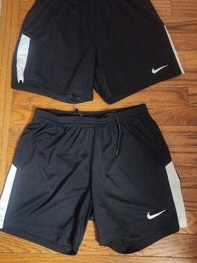 Pair Of Nike Black Athletic Shorts with White Swoosh